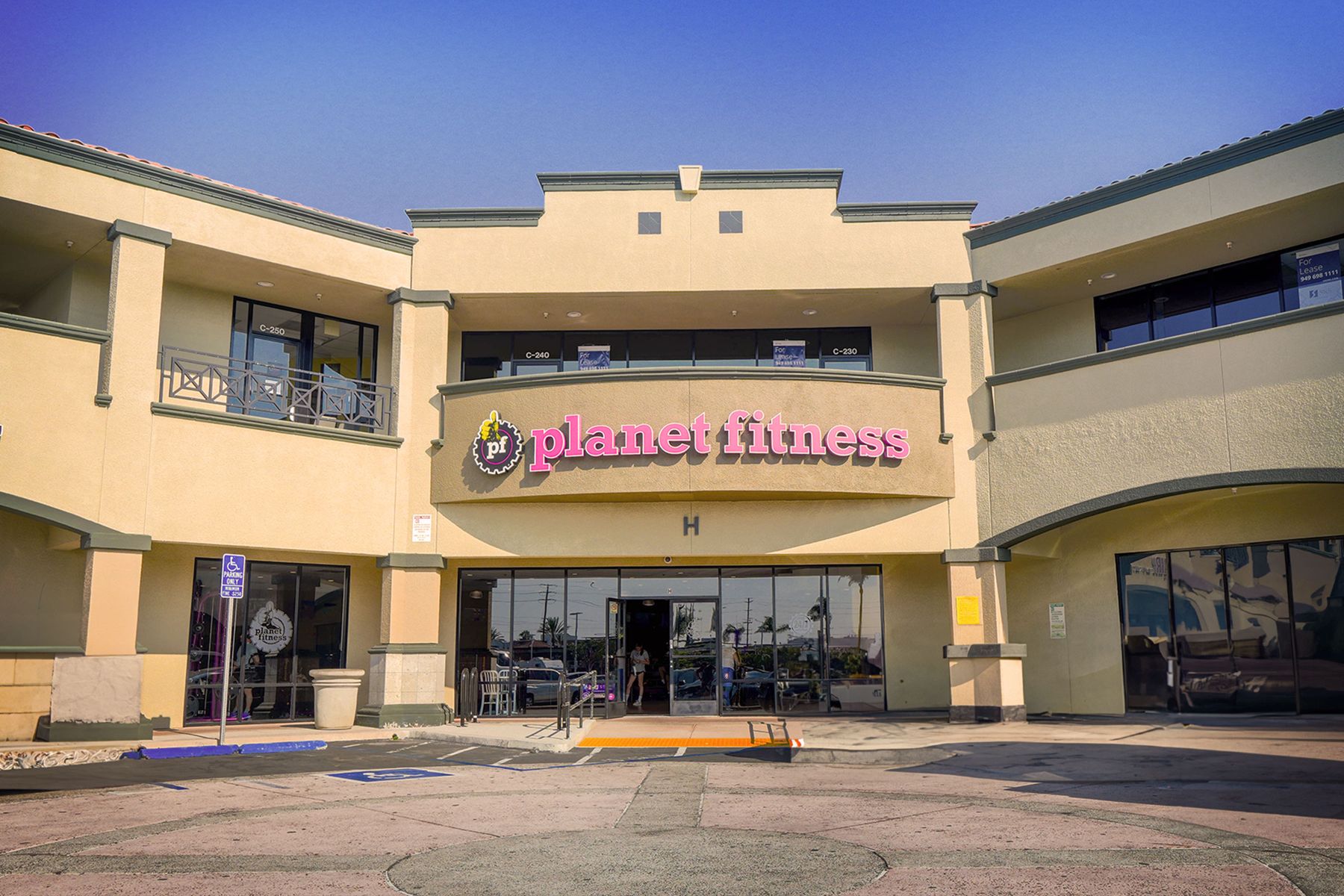 Fitness center storefront in a two-storey retail plaza